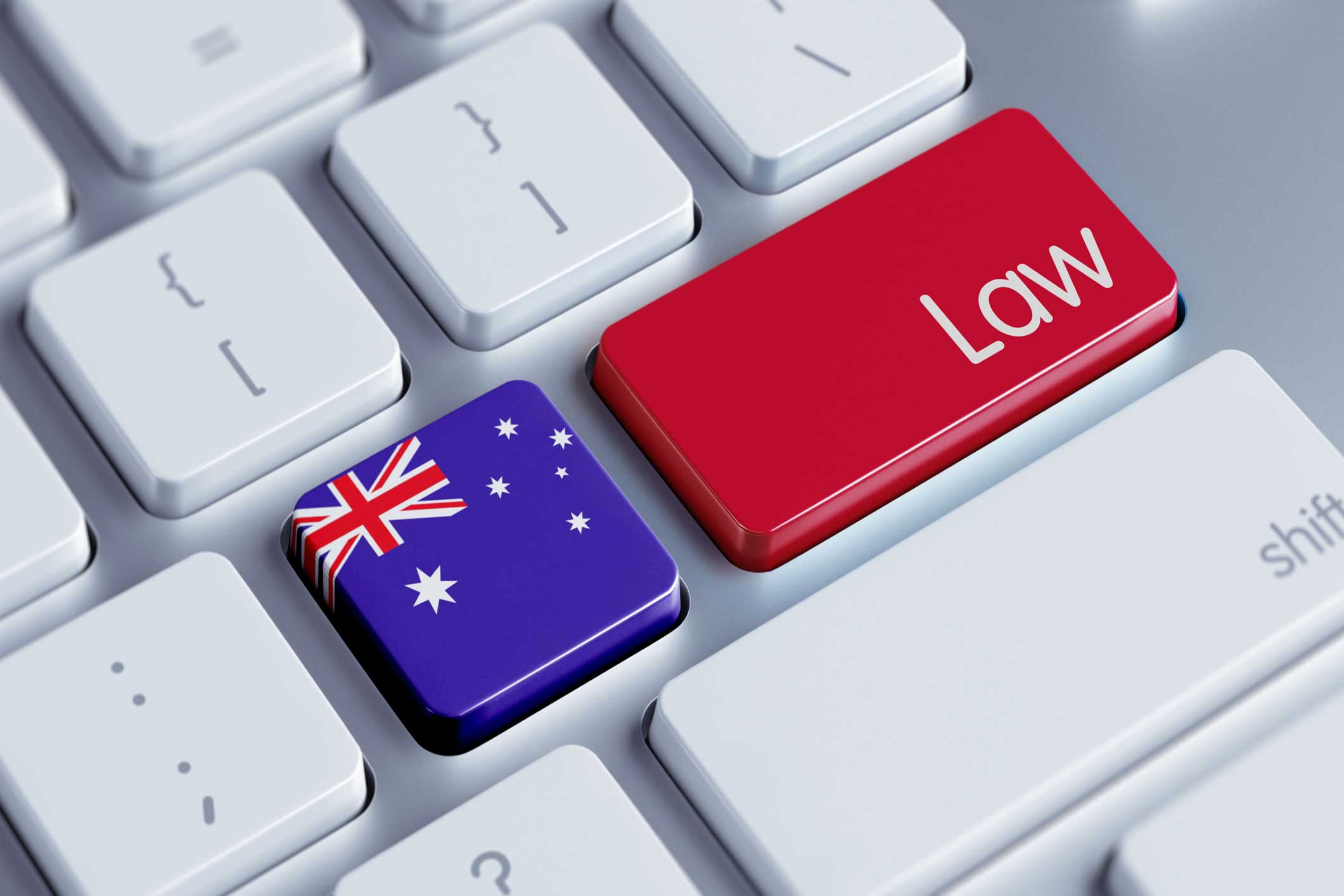 Laptop keyboard, one key painted as the Australian flag and another key red that says Law